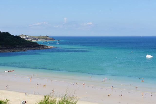 View of Carbis Bay Beach from above of people on the beach.