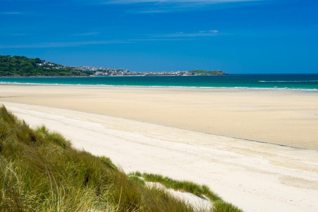 The sand dunes and soft sandy beach on the St Ives to Lelant Walk in Cornwall