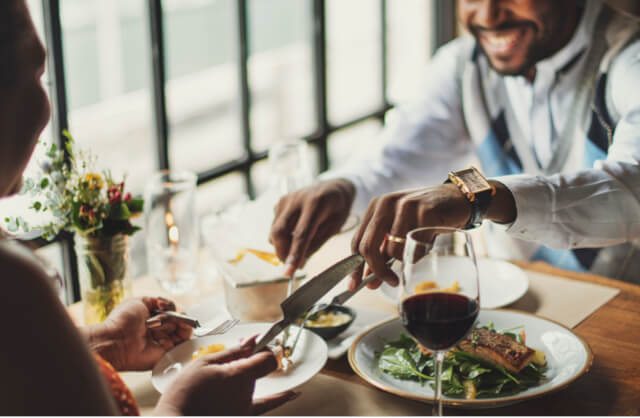 Couple enjoying a meal in a restaurant.