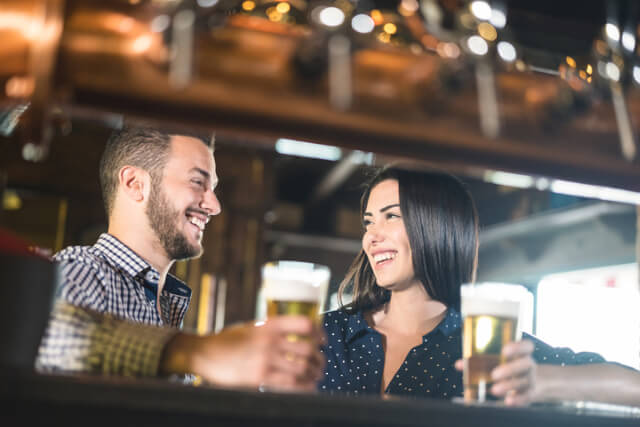 Couple enjoying beer in a pub.