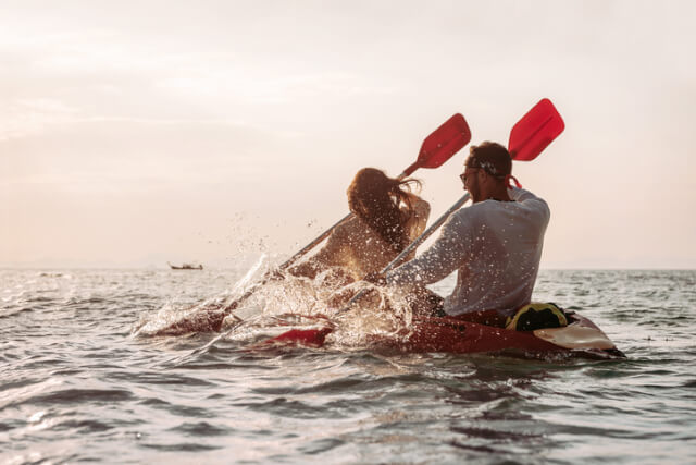 Couple kayaking in the sea.