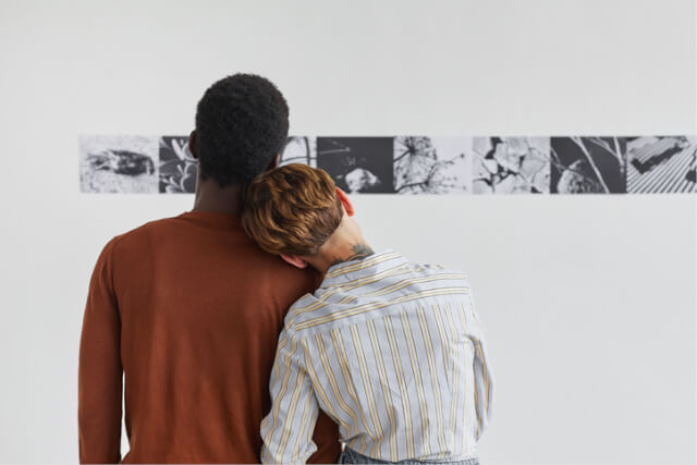Couple viewing art in a gallery.