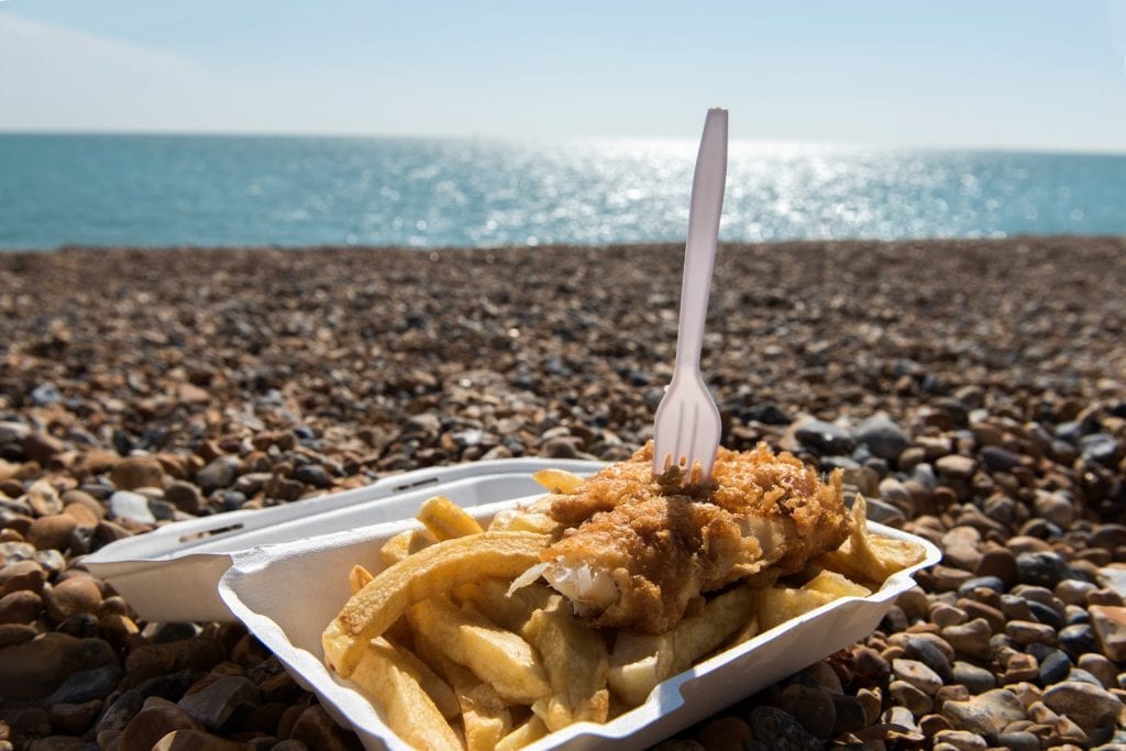 Delicious fish and Chips take away meal enjoyed on the beach