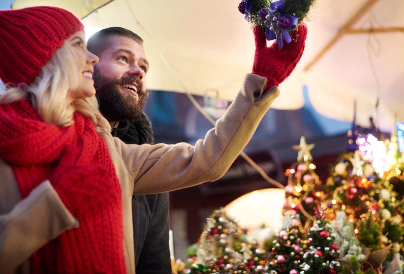 Couple looking at Christmas decoration.