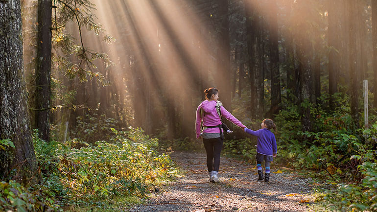 Walks in Cornwall - mother and child in woods