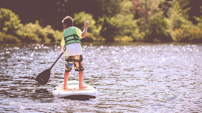 child paddleboarding