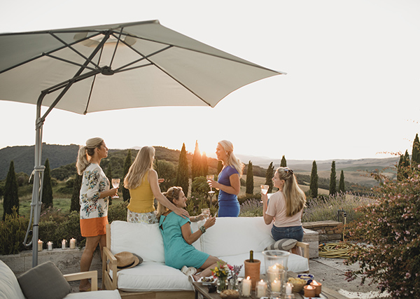 women enjoying the sun drinking wine. Self catering holiday guide for groups